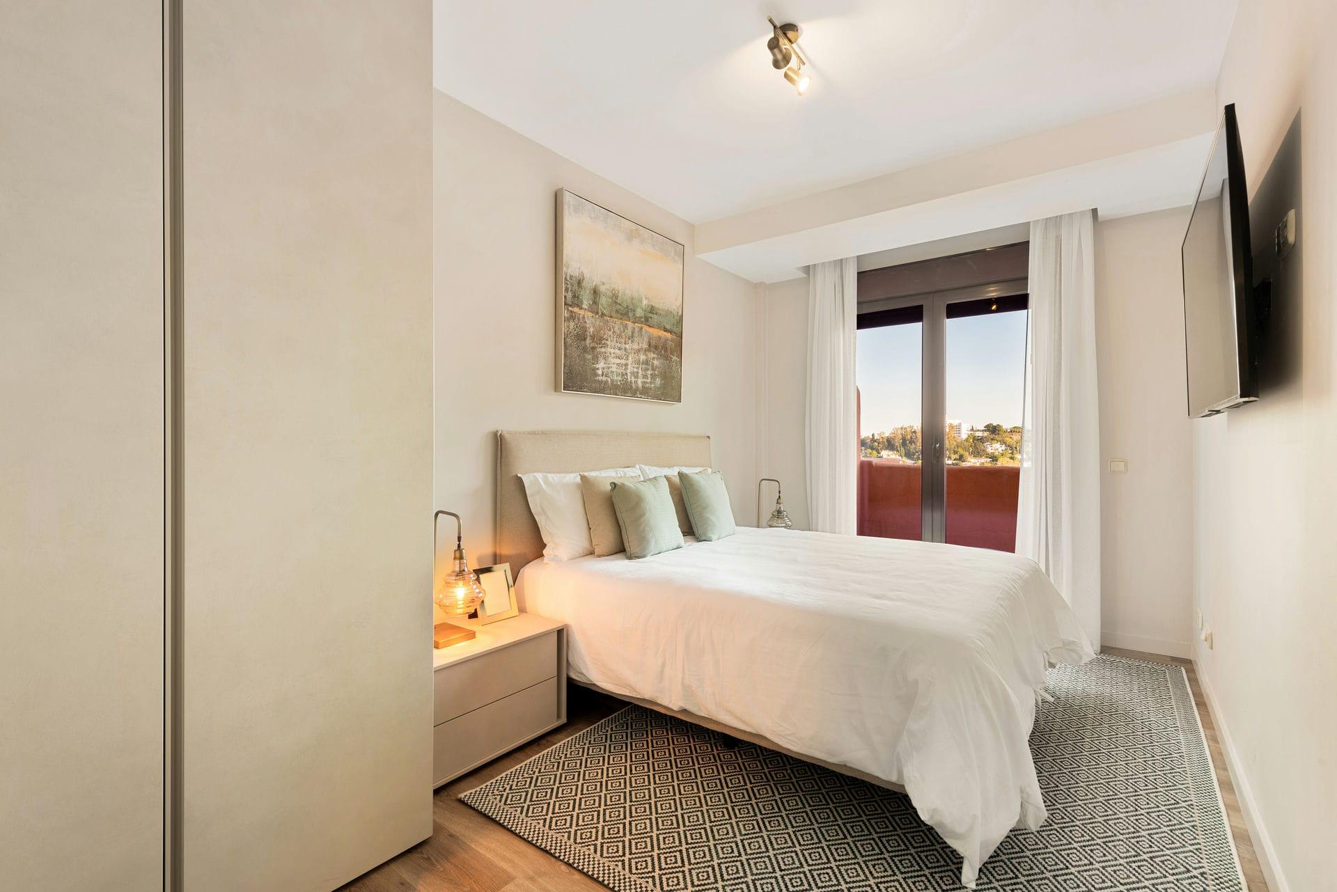 Development entrance with planted landscaping, new-build apartment block, Cortés, Benahavis