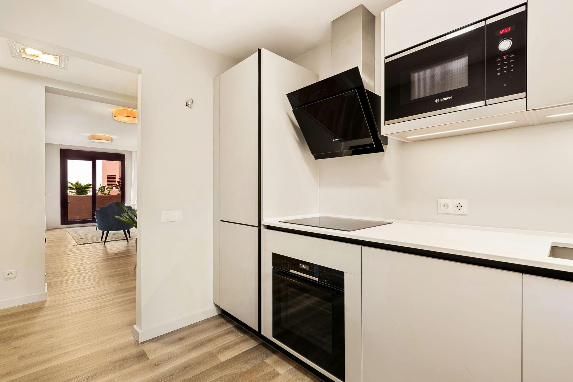 Kitchen appliances and upper cabinet detail, new-build apartment, Cortés, Benahavis