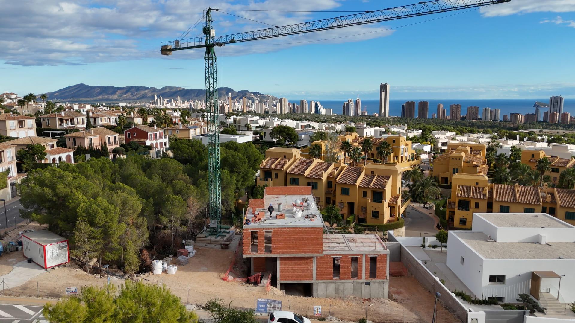 Rear exterior of new-build villa showing garden level, Sierra Cortina, Finestrat