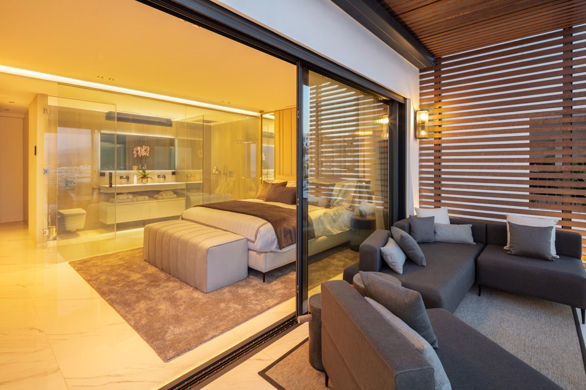 Dining area adjacent to open-plan kitchen in new-build apartment, Puerto, Marbella