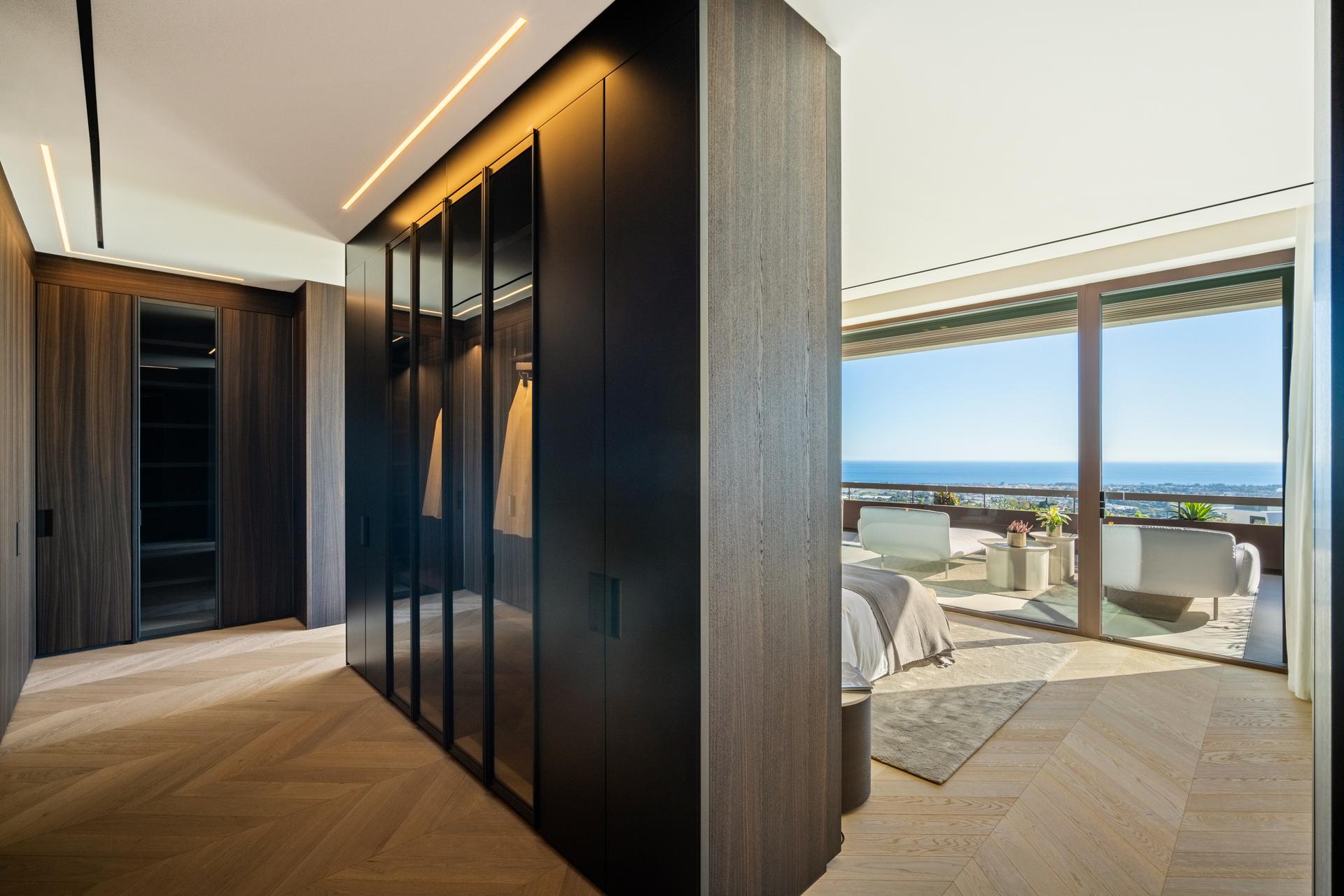 Bedroom interior with large window and natural light, new-build villa, La Quinta, Benahavis