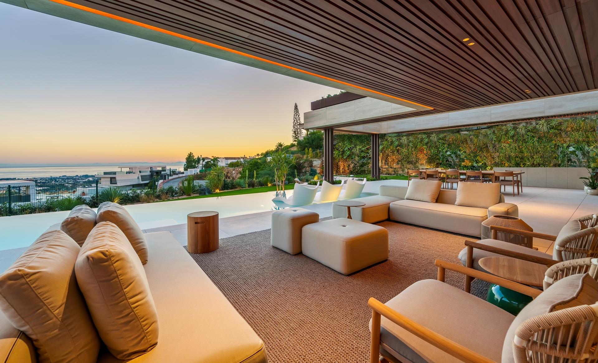 Exterior facade at dusk, new-build villa, La Quinta, Benahavis