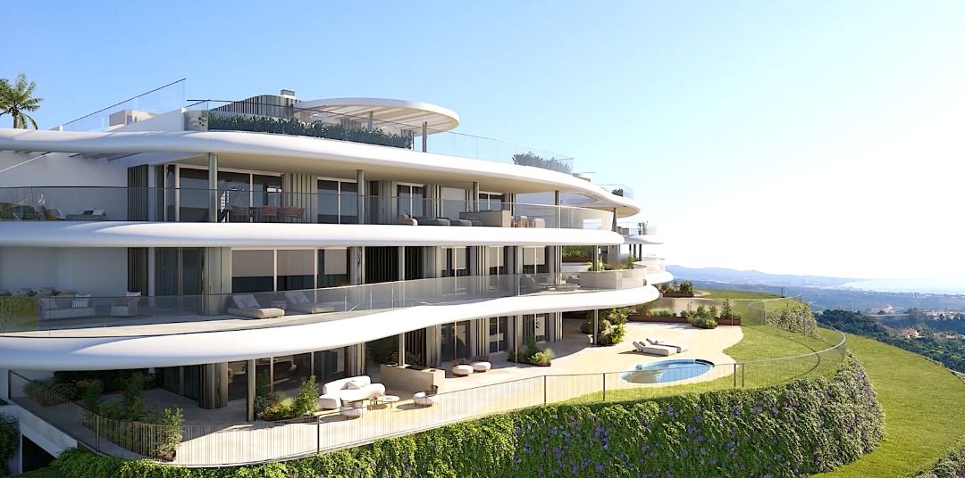 Development entrance with planted landscaping, La Quinta, Benahavis