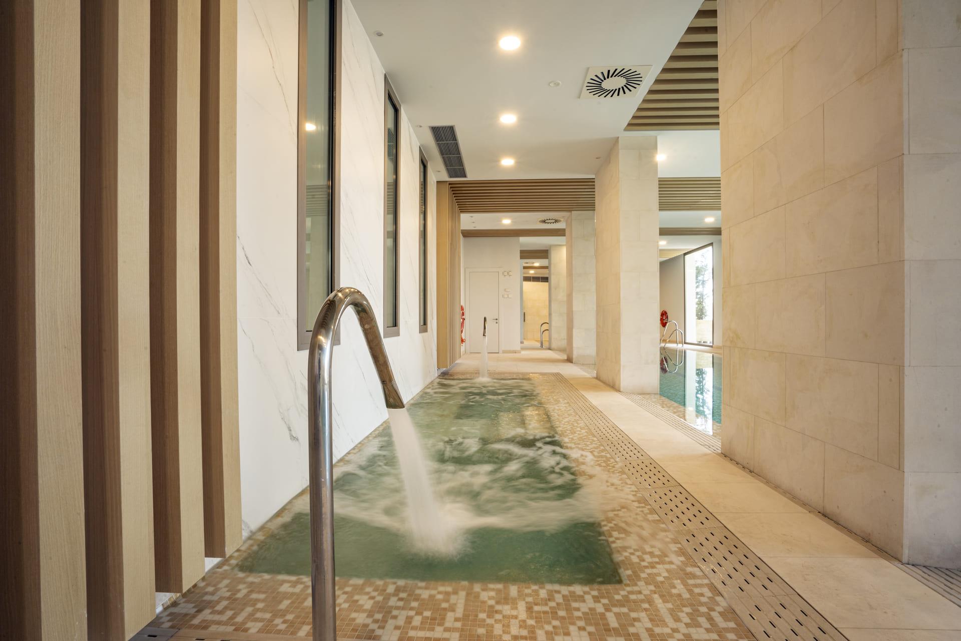 Living room with floor-to-ceiling glazing in new-build penthouse, La Quinta, Benahavis