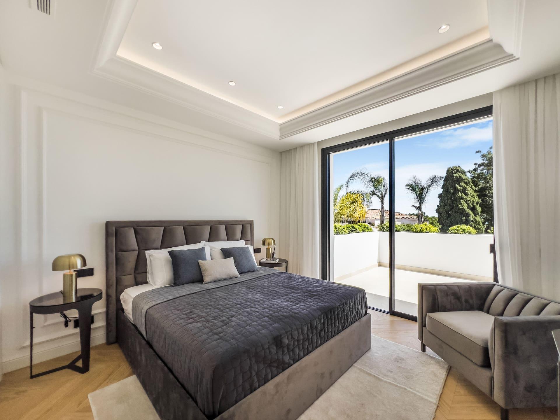 Living area with floor-to-ceiling glazing and garden views, Las Lomas de Río Verde, Marbella