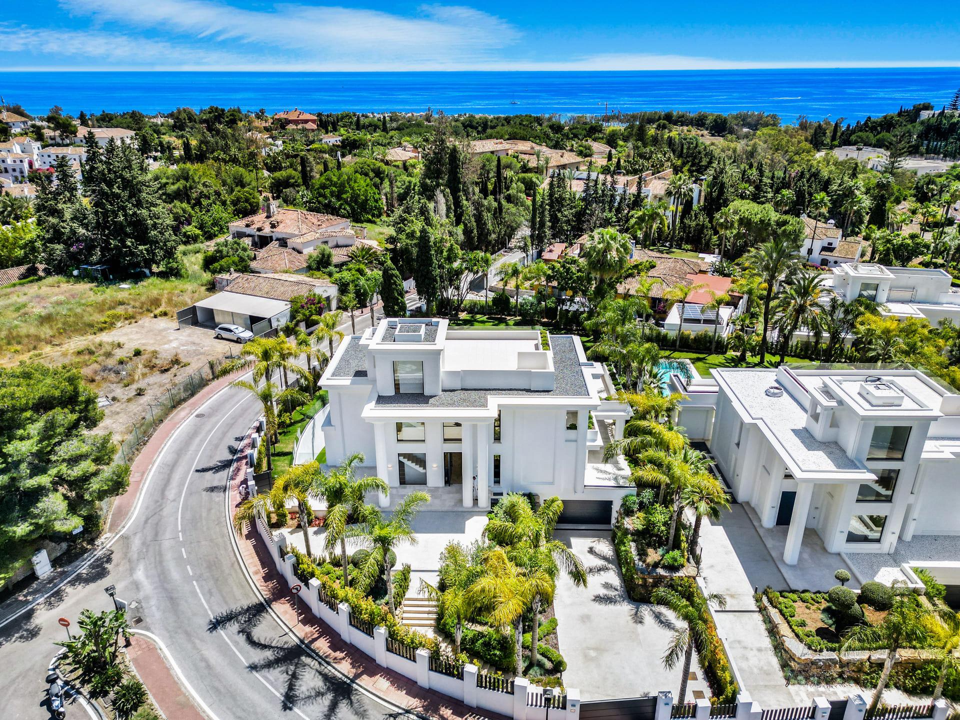 Rear exterior of 6-bedroom new-build villa showing terraces and garden, Las Lomas de Río Verde