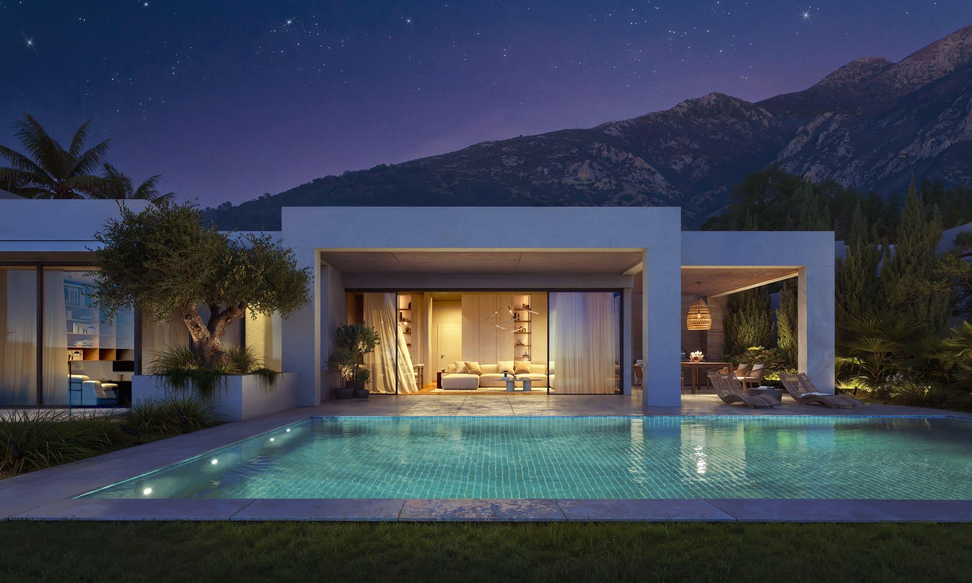 Rear garden and pool surround with paved terrace at villa, El Higuerón, Mijas