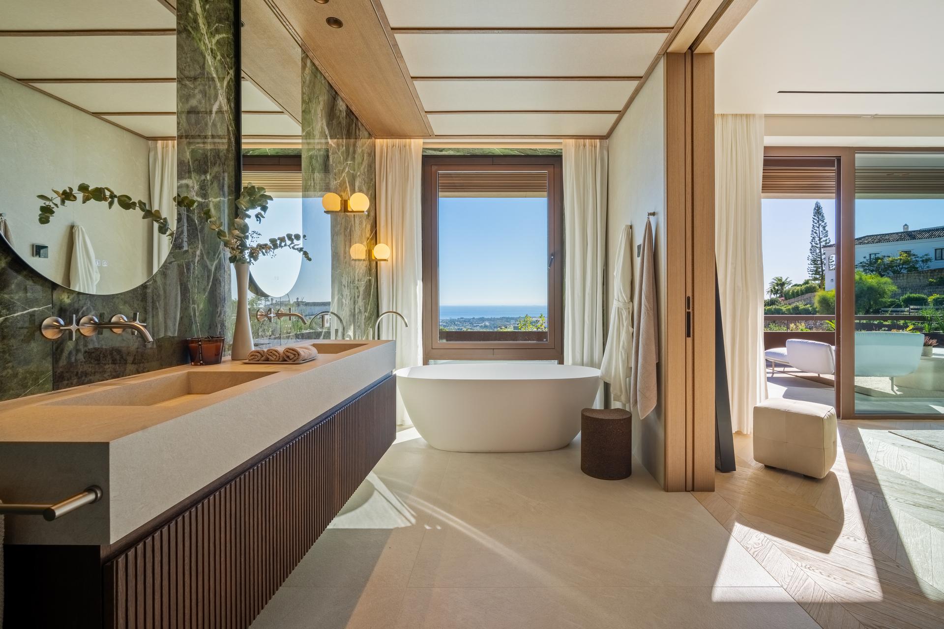 Covered rear terrace with outdoor seating in new-build villa, La Quinta