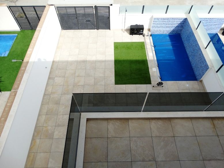 Pool area with landscaping in new-build development, Zona Pueblo, Pilar De La Horadada