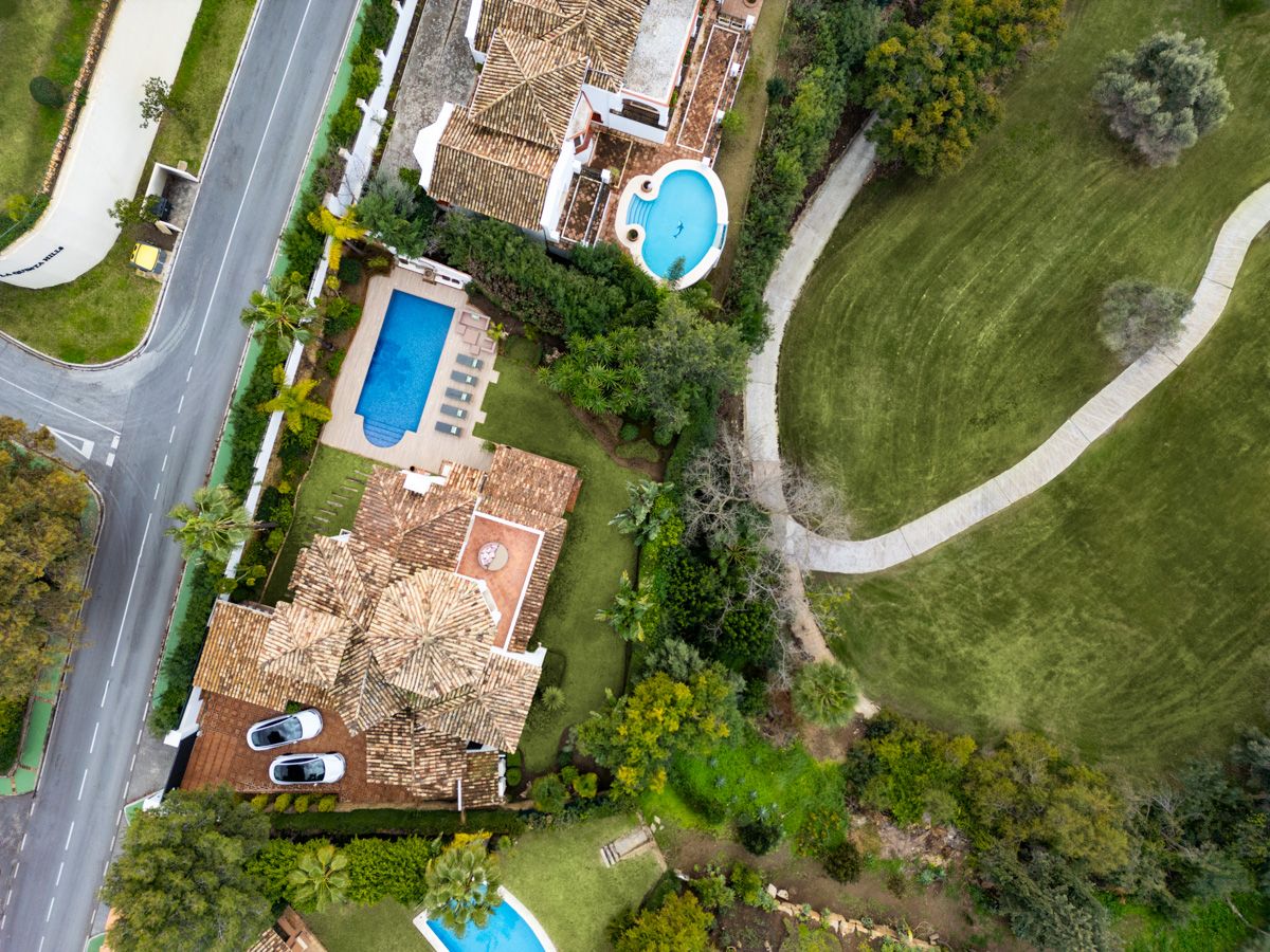 Covered outdoor seating area on terrace of new-build villa, La Quinta, Benahavis