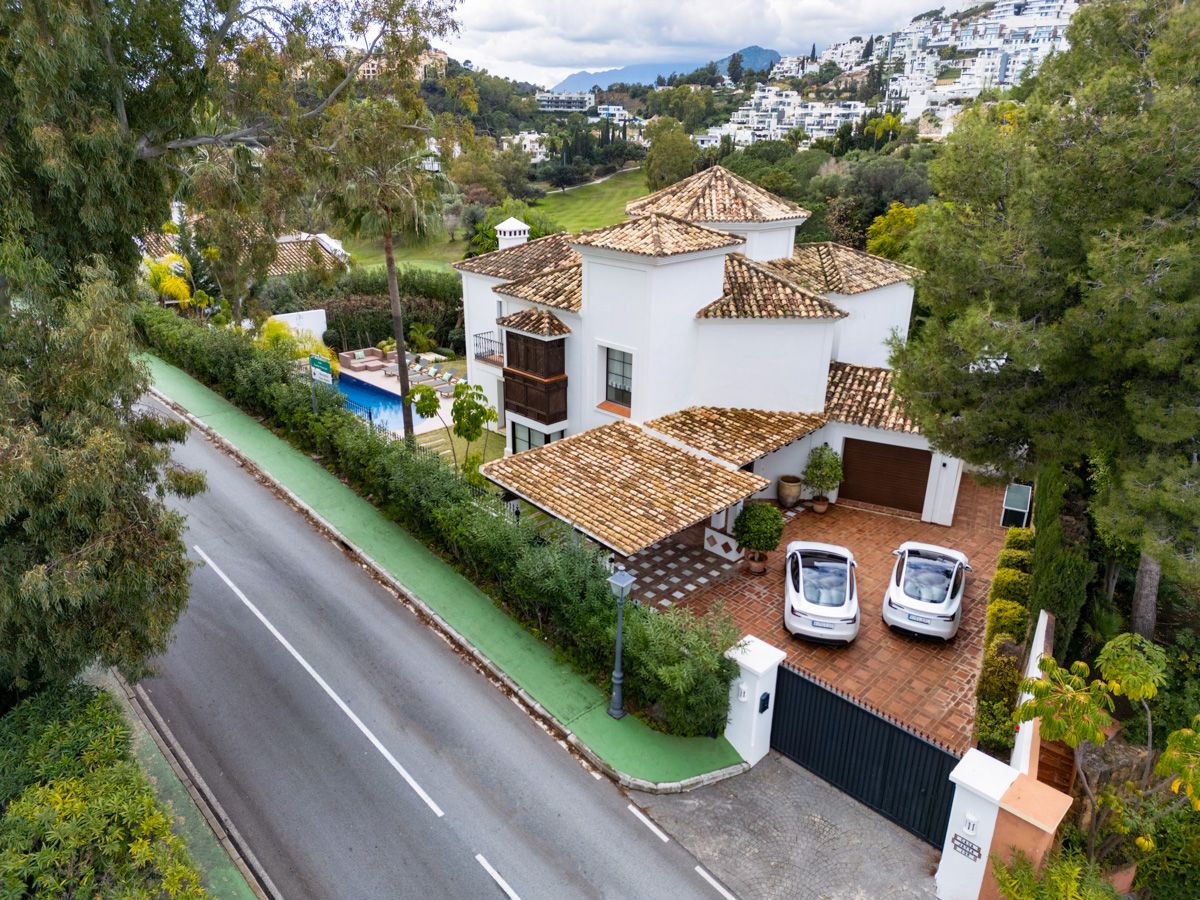 Night-time exterior of new-build 4-bedroom villa showing lighting, La Quinta, Benahavis