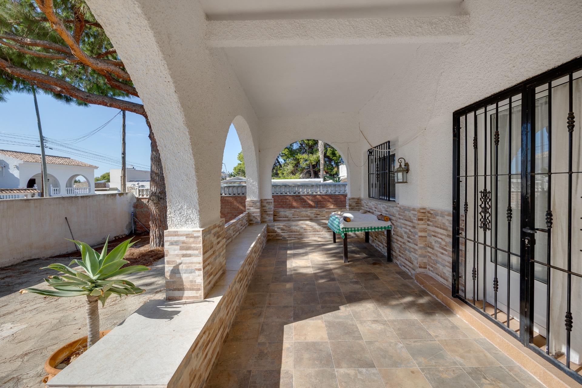 Living room with fireplace, tiled floor and air conditioning unit